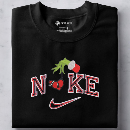 Nike letters with Grinch hand holding Bad Bunny heart.